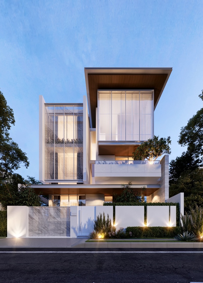 Hàng rào biệt thự được sử dụng chất liệu bê tông sơn trắng kết hợp cùng cây xanh bên trong